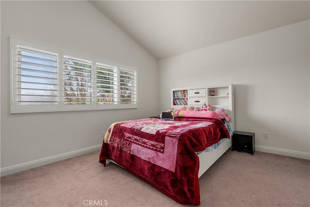 carpeted bedroom with vaulted ceiling