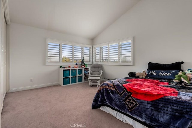 carpeted bedroom featuring lofted ceiling