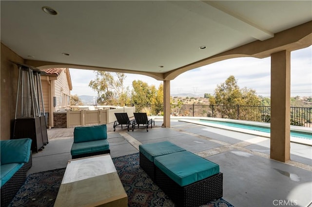 view of patio / terrace featuring a fenced in pool and an outdoor hangout area