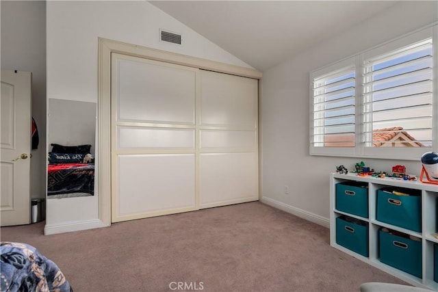 carpeted bedroom featuring vaulted ceiling