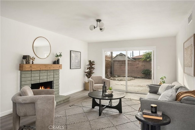 living room featuring a fireplace and light hardwood / wood-style flooring