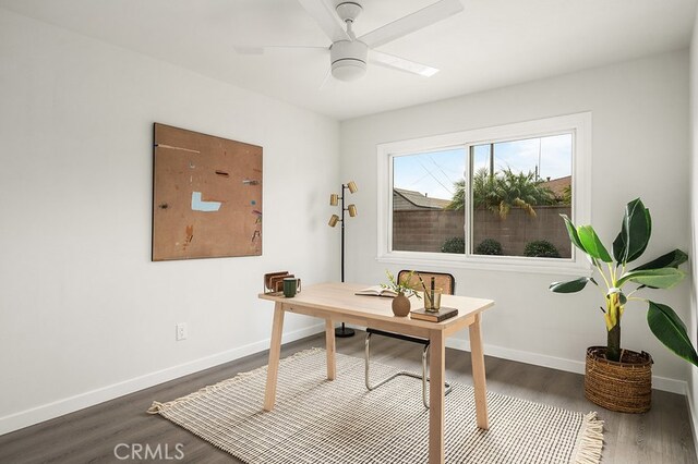 office area with ceiling fan and dark hardwood / wood-style flooring