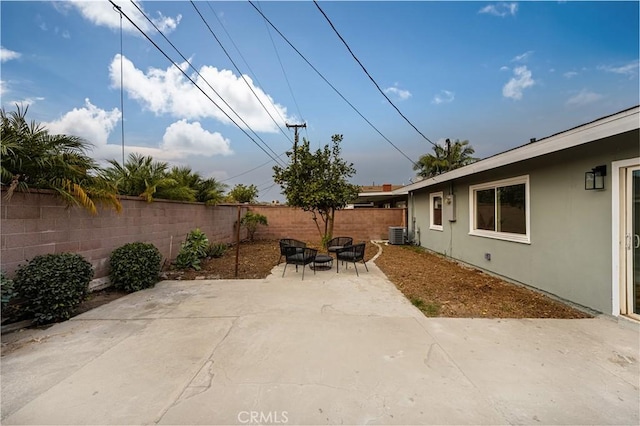 view of patio / terrace featuring central AC and an outdoor fire pit