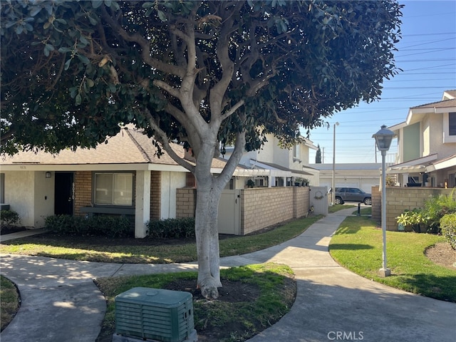 view of side of home with a lawn