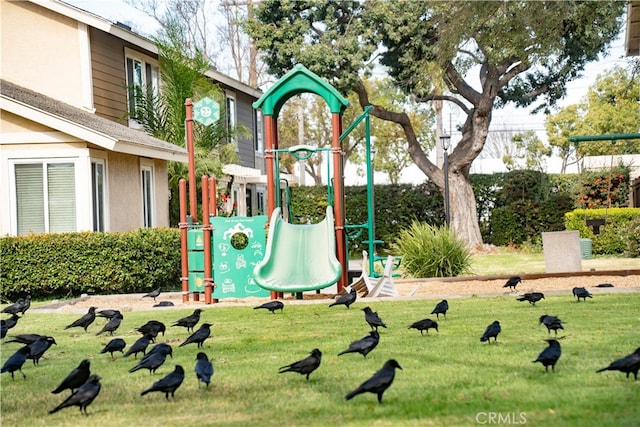 view of jungle gym with a lawn