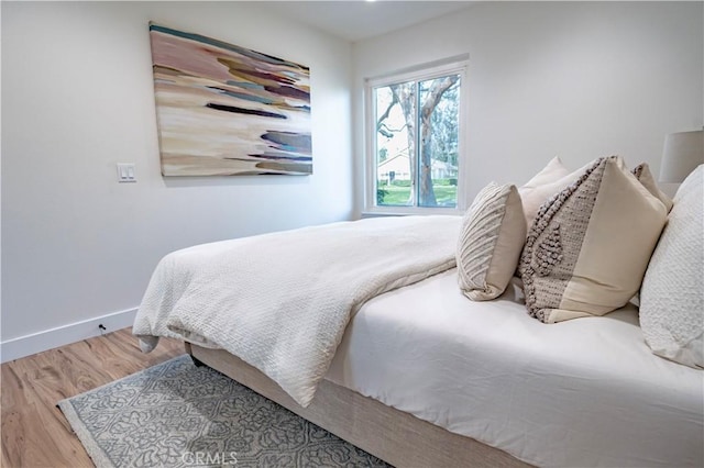 bedroom with hardwood / wood-style floors