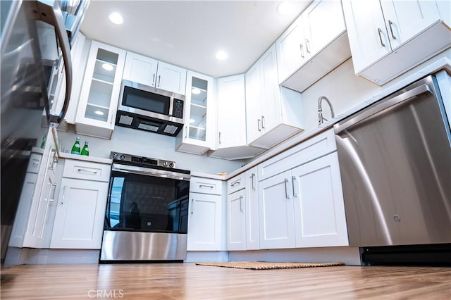 kitchen with white cabinetry and stainless steel appliances