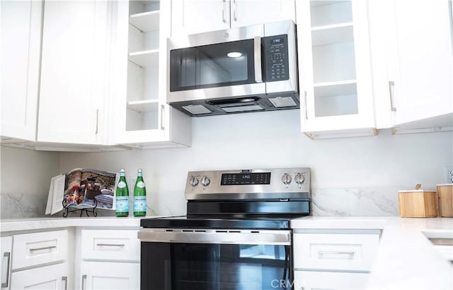 kitchen with stainless steel appliances and white cabinets