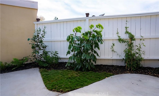 view of property exterior with a patio area