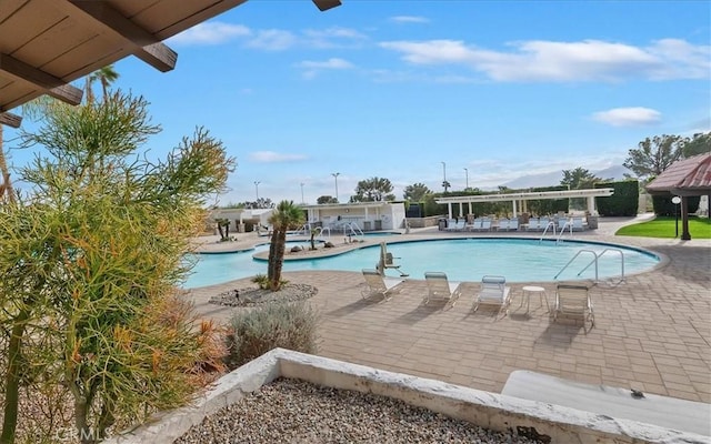 community pool featuring a patio area and a pergola