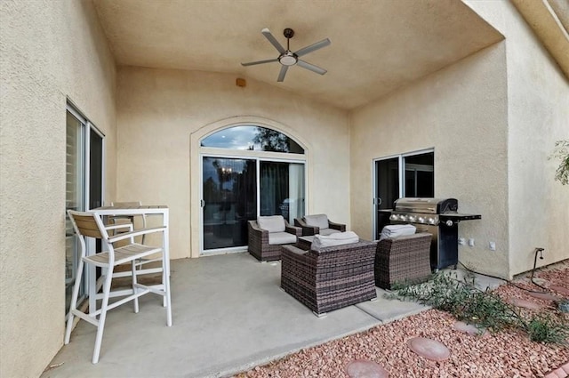 view of patio featuring outdoor lounge area, area for grilling, and a ceiling fan