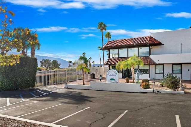 exterior space featuring curbs and a mountain view