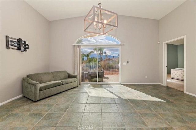 interior space with lofted ceiling, an inviting chandelier, tile patterned flooring, and baseboards