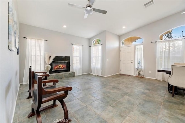 entryway with a tile fireplace, recessed lighting, visible vents, baseboards, and a ceiling fan