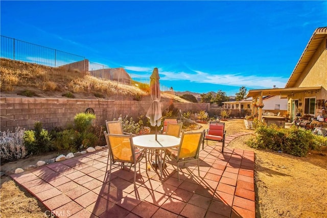 view of patio with a mountain view