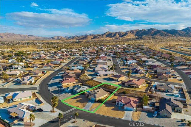 drone / aerial view featuring a mountain view