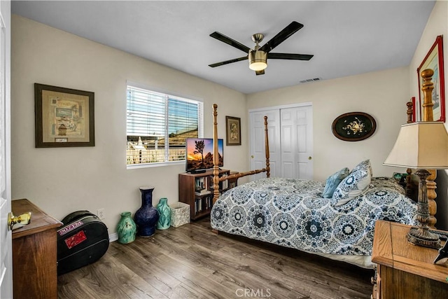 bedroom featuring a closet, hardwood / wood-style flooring, and ceiling fan