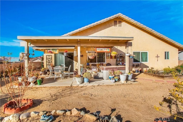 back of house featuring a patio area