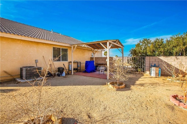 exterior space with cooling unit and a patio