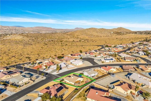 drone / aerial view featuring a mountain view