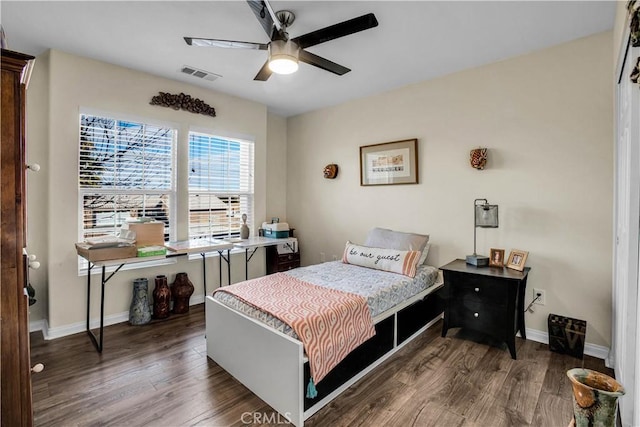 bedroom featuring ceiling fan and dark hardwood / wood-style floors