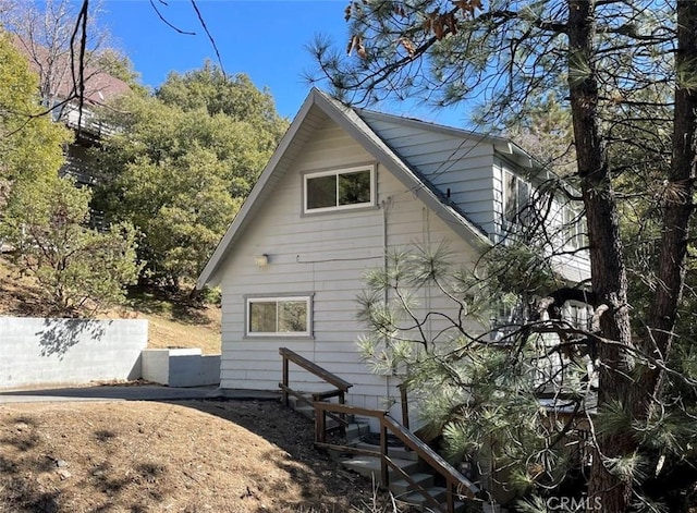 view of property exterior featuring fence