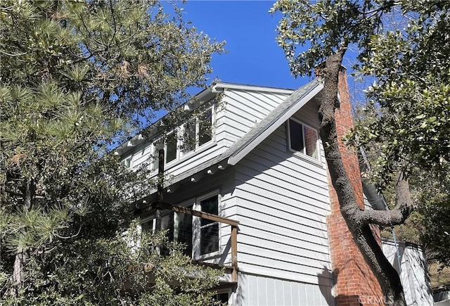 view of side of home with a chimney