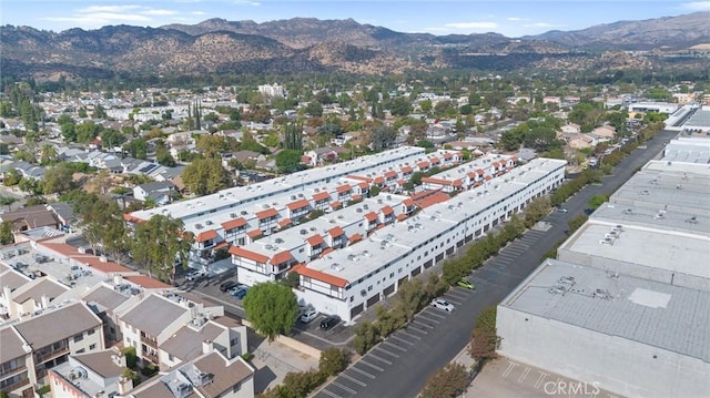 birds eye view of property with a mountain view