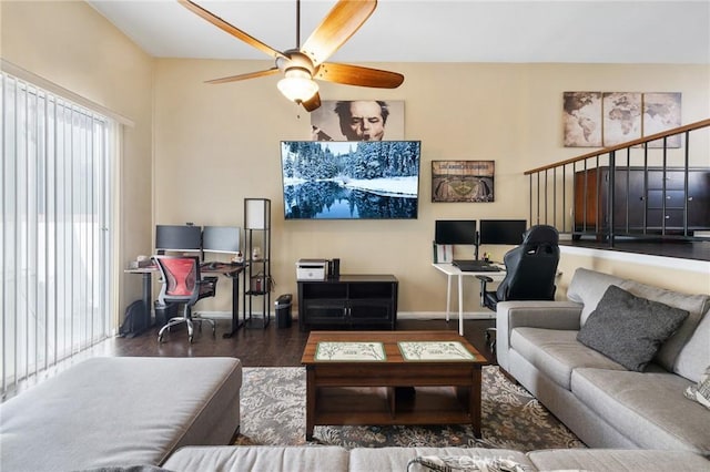 living room with ceiling fan and dark wood-type flooring