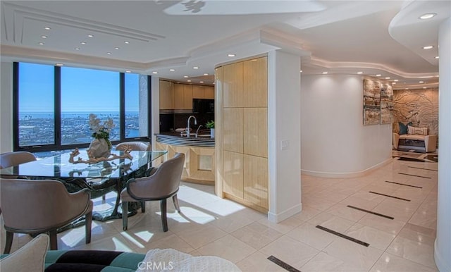 dining room with sink and light tile patterned flooring