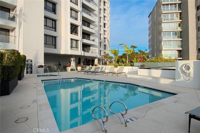 view of swimming pool featuring a patio