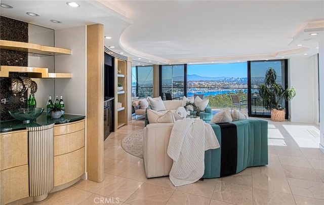 tiled living room with expansive windows and a mountain view