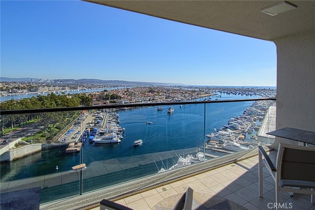 balcony featuring a water view