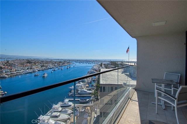 balcony featuring a water view