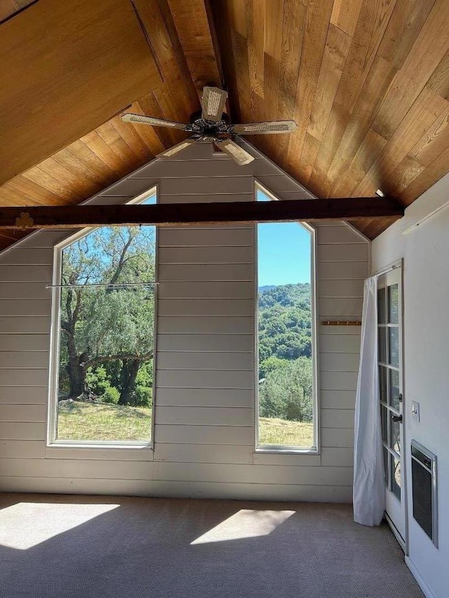 bonus room with heating unit, wood walls, wood ceiling, and vaulted ceiling with beams