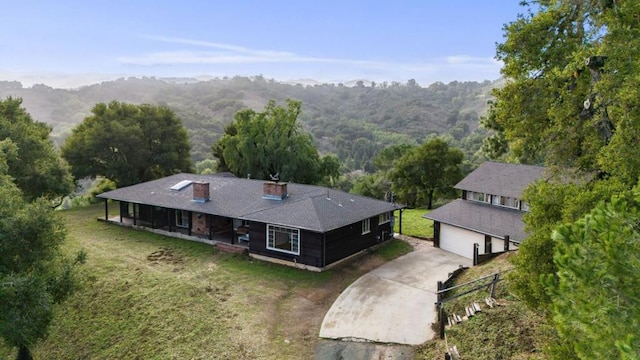 birds eye view of property featuring a mountain view