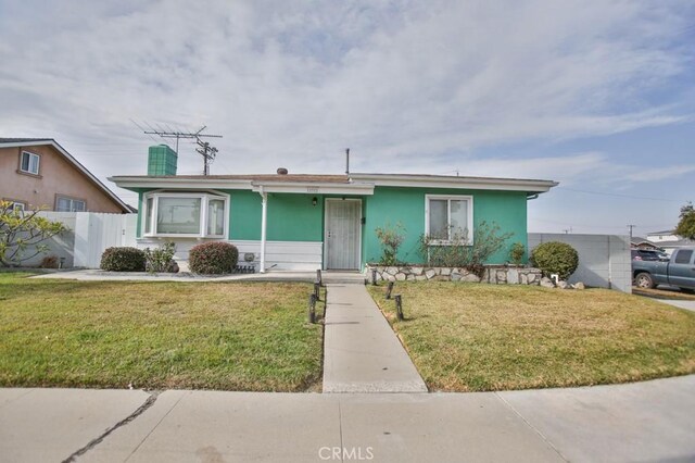 ranch-style house with a front lawn