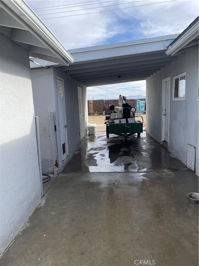 garage featuring a carport