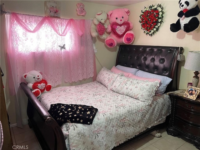 bedroom featuring light tile patterned floors