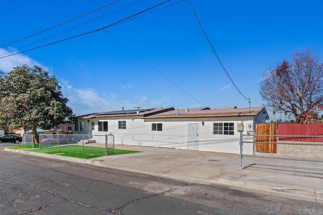 single story home with solar panels