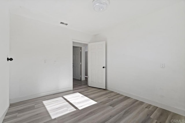 spare room with light hardwood / wood-style floors