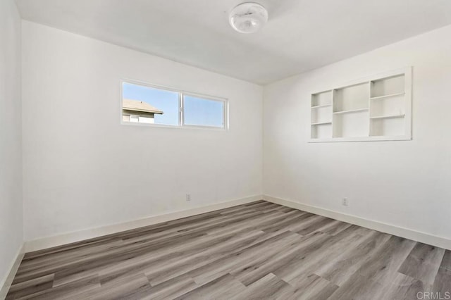 empty room featuring hardwood / wood-style flooring