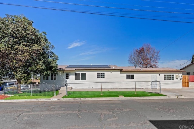 single story home with solar panels