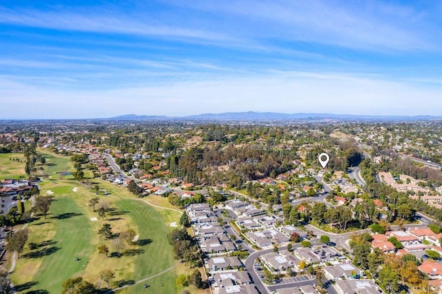 bird's eye view with view of golf course, a residential view, and a mountain view