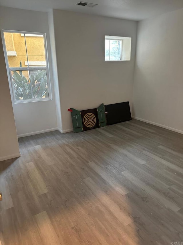 unfurnished room with light hardwood / wood-style floors