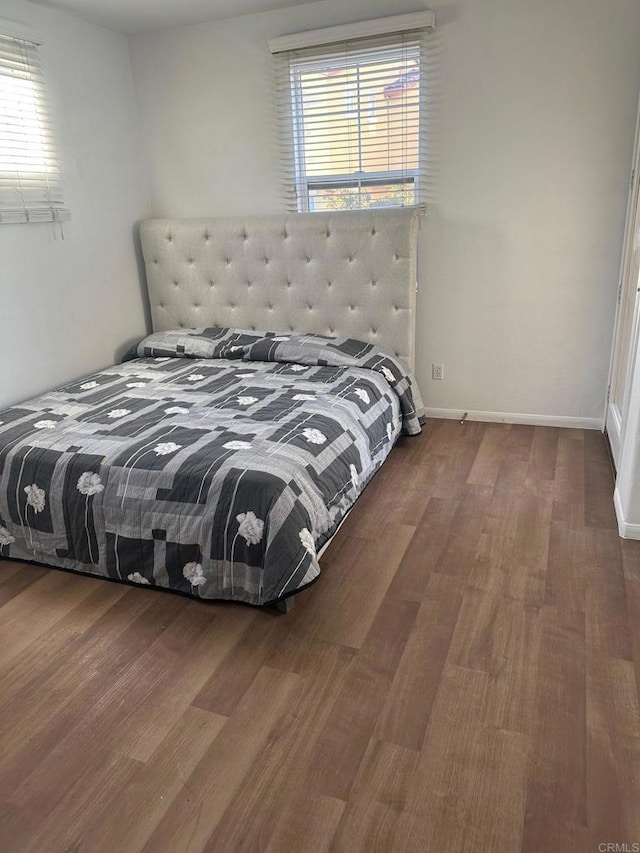 bedroom with wood-type flooring