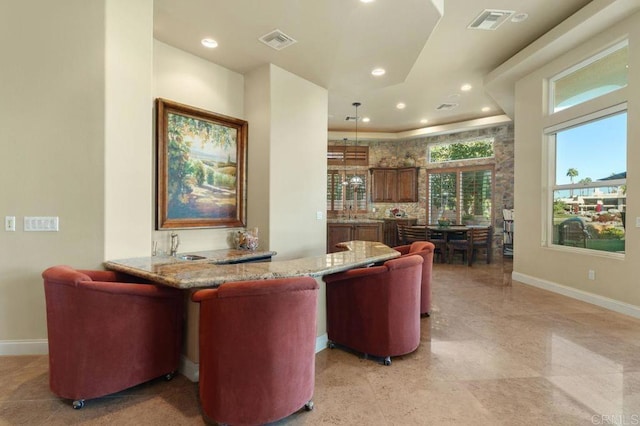 interior space with baseboards, visible vents, and recessed lighting