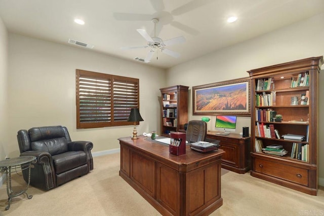 office featuring a ceiling fan, recessed lighting, visible vents, and light carpet