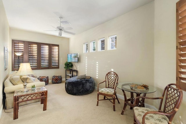 sitting room with ceiling fan, visible vents, baseboards, and carpet flooring