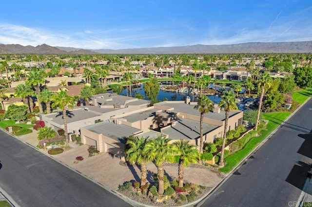 drone / aerial view with a residential view and a water and mountain view